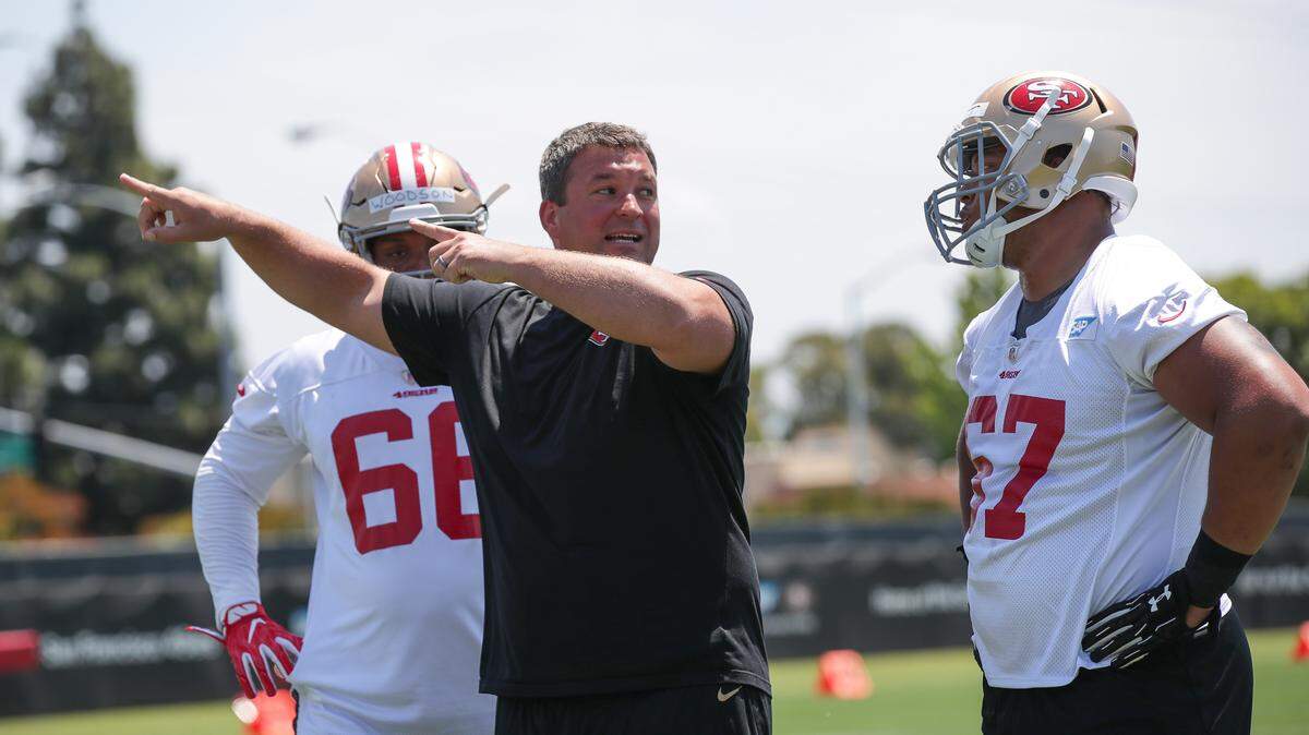 New pass rush specialist Chris Kiffin works with 49ers defensive linemen during a recent practice.