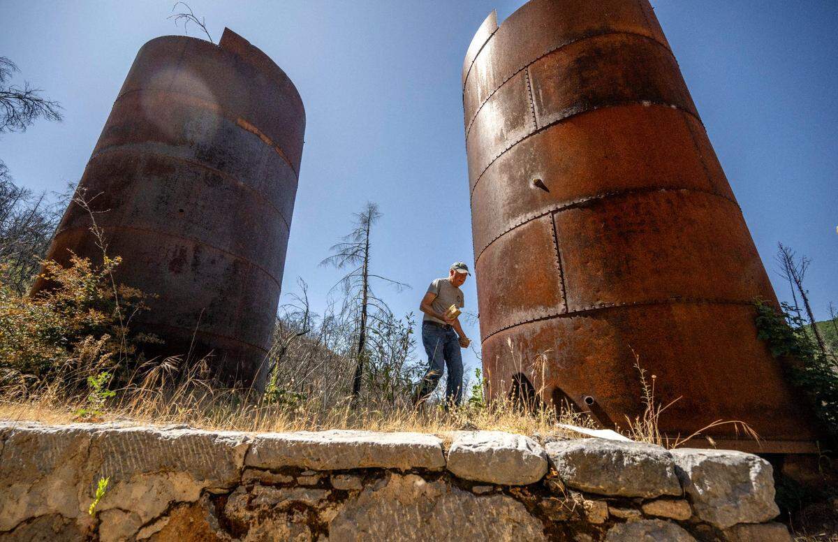 Jim Wood, a board member with the nonprofit Colfax Lime Kiln Preserve, walks last month near a historic lime kiln that was rediscovered after a 2021 wildfire in Placer County.