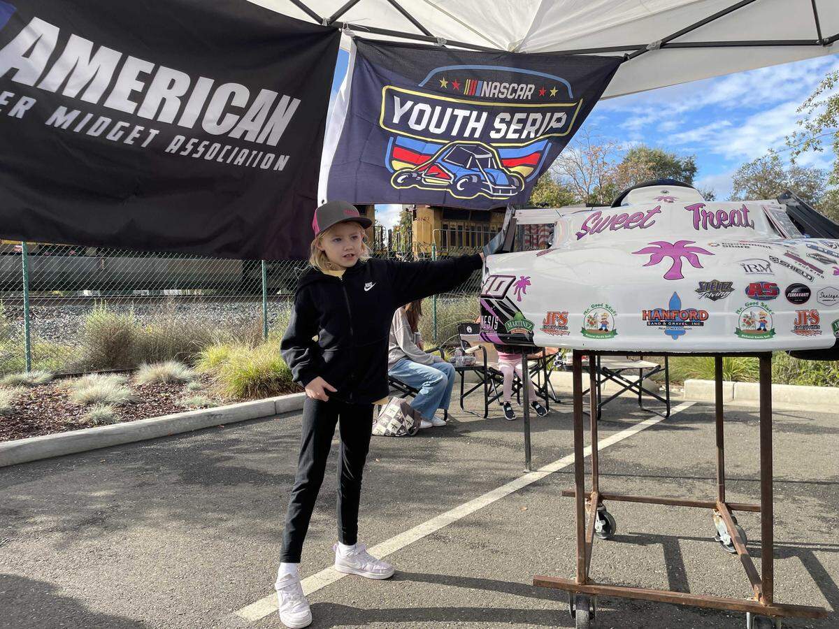 Sophia Smith, 8, of Clements showed off her midget kart she made with her dad, named Sweet Treat. She awaited to meet NASCAR Cup Series winner Kyle Larson in Elk Grove.
