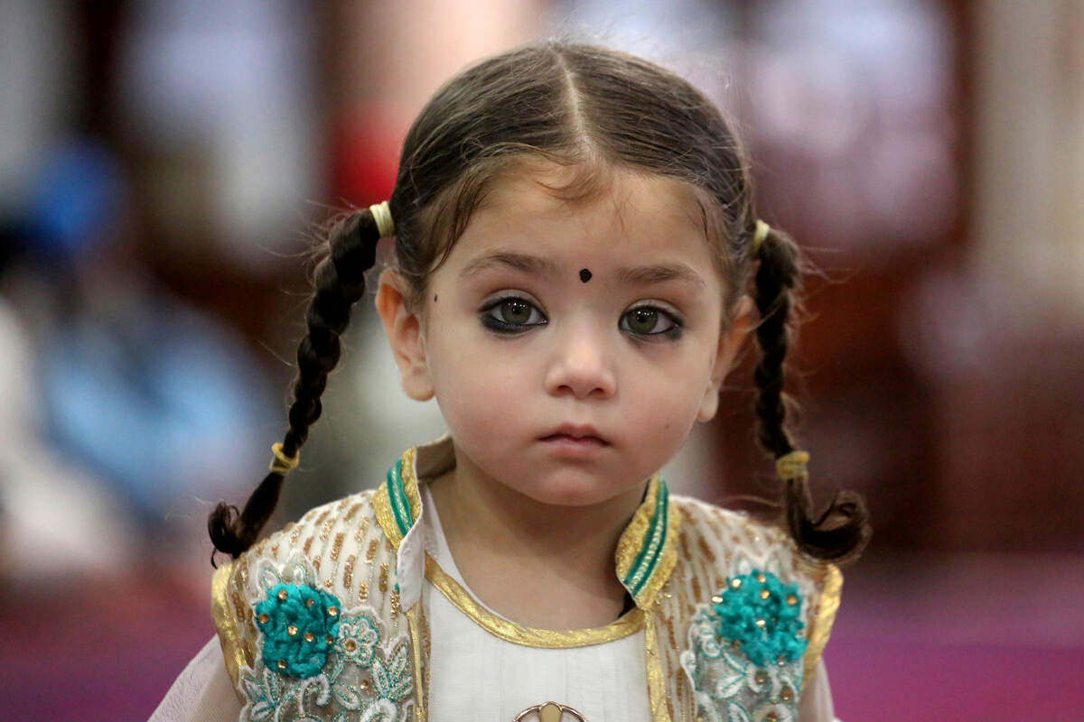 A girl attends a marriage ceremony near the Afghanistan border in 2018 wearing traditional eye makeup known as surma or kohl, which often contains lead. Cosmetics are a frequent source of elevated lead levels in humans.