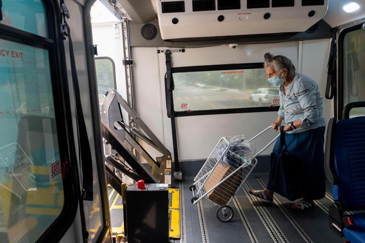 Rosalie Rashid, 81, walks onto the lift on a SmaRT Ride Sacramento Regional Transit bus after a day of running errands on Friday, Sept. 11, 2020. “I’m much less tired using this because they drop me right off at my front door,” said Rashid.