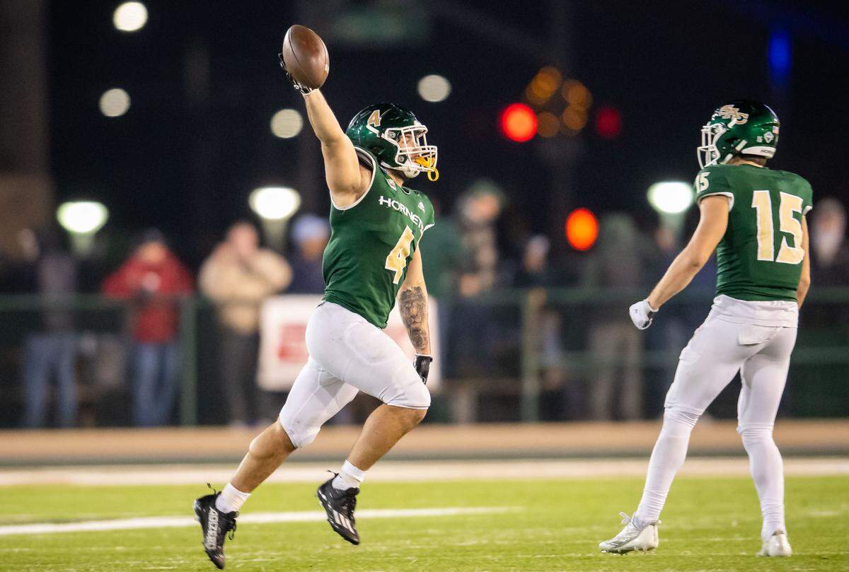 Sacramento State Hornets running back Cameron Skattebo (4) runs with the ball after recovering an onside kick against University of the Incarnate Word (Texas) during the fourth quarter of the NCAA college football FCS playoffs quarterfinal game Friday, Dec. 9, 2022, at Hornet Stadium in Sacramento. The Cardinals beat the Hornets, 66-63.