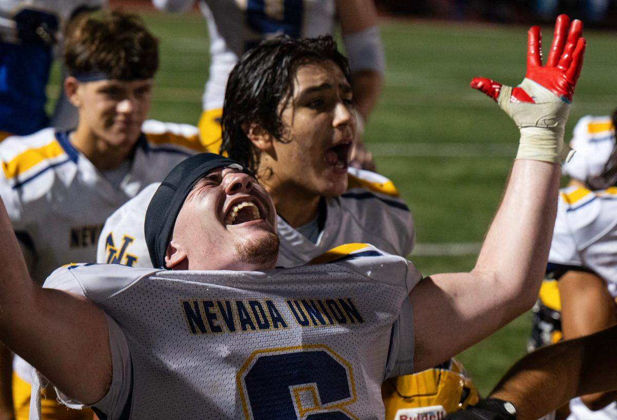 Nevada Union Miners linebacker Jake Barefield (6), back in action from a broken leg, and his teammates celebrate after defeating the Del Campo Cougars in on Friday.
