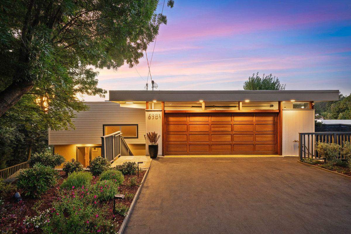 The Norther California residence with a glass terrace looks understated from the front.