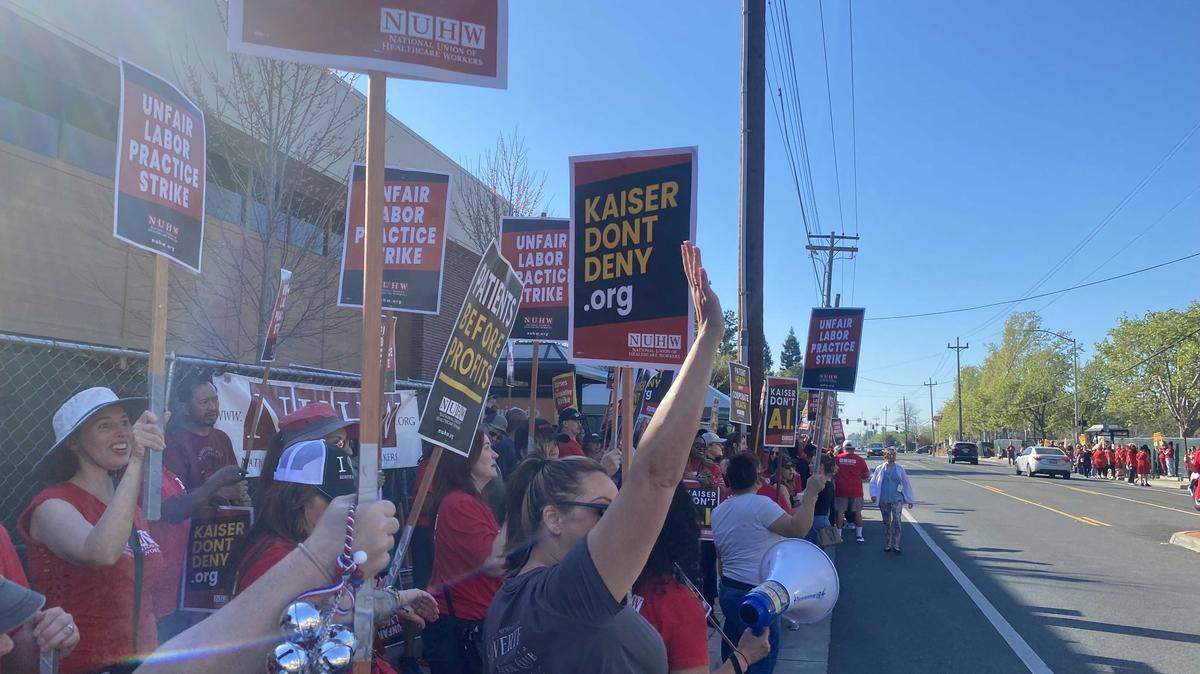 Union members and supporters rally Wednesday outside Kaiser Permanente's hospital on Morse Avenue in Sacramento in solidarity with the National Union of Healthcare Workers' one-day strike.