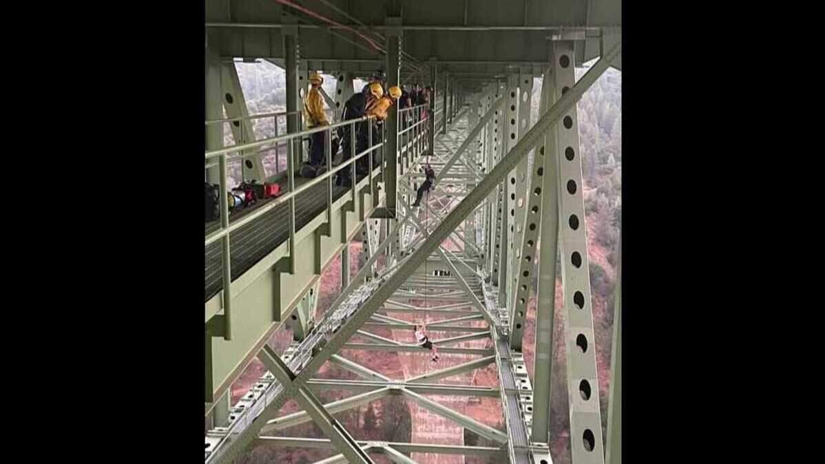 Placer County first responders rescued a 19-year-old man Monday who became stuck dangling from the Foresthill Bridge when his equipment failed while filming a video.
