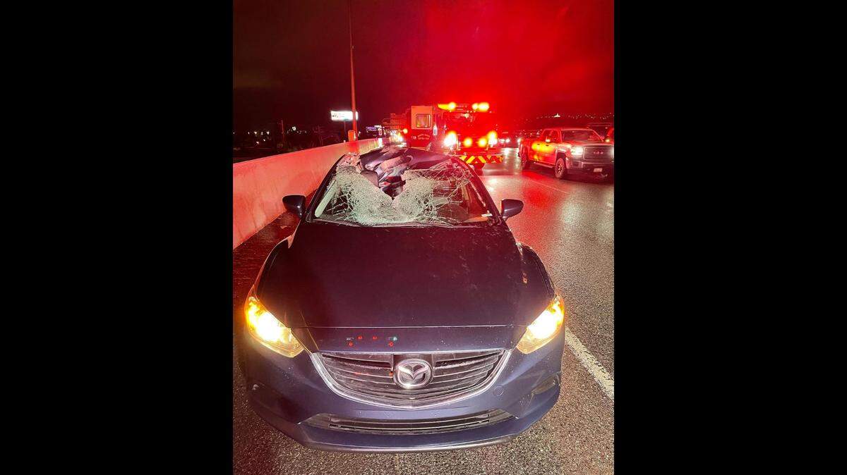 A tire flew into another car’s windshield on Interstate 15 in Bountiful, Utah, officials said on Jan. 18, 2023. The driver had a cut on her head from the incident.