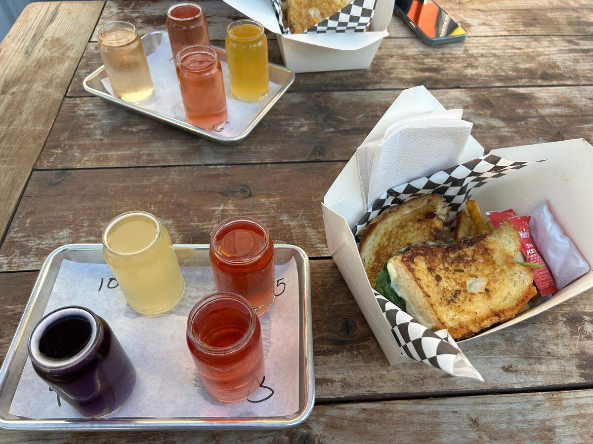 Sacramento Bee reporter Veronica Fernandez-Alvarado bought a flight of ciders from Nitty’s Cider and a grilled cheese sandwich from Tipsy Cheese for under $25 on Thursday, April 17, 2025.