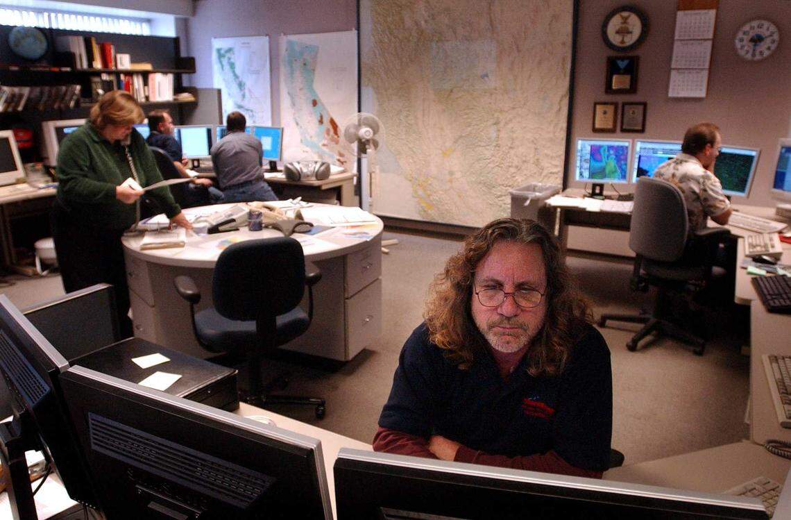 Meteorologists work on a weather forecast at the National Weather Service office in Arden Arcade in 2005. Today, the Sacramento office is operating with fewer than half of its forecast positions filled, forcing it to end overnight operations and rely on out-of-region support to cover critical weather alerts across Northern California.
