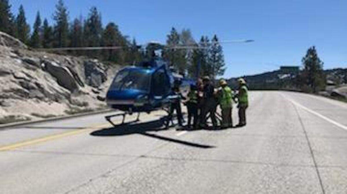 An air ambulance lands on Interstate 80 in response to an overturned vehicle crash near Kingvale on Friday, according to Caltrans and fire officials.