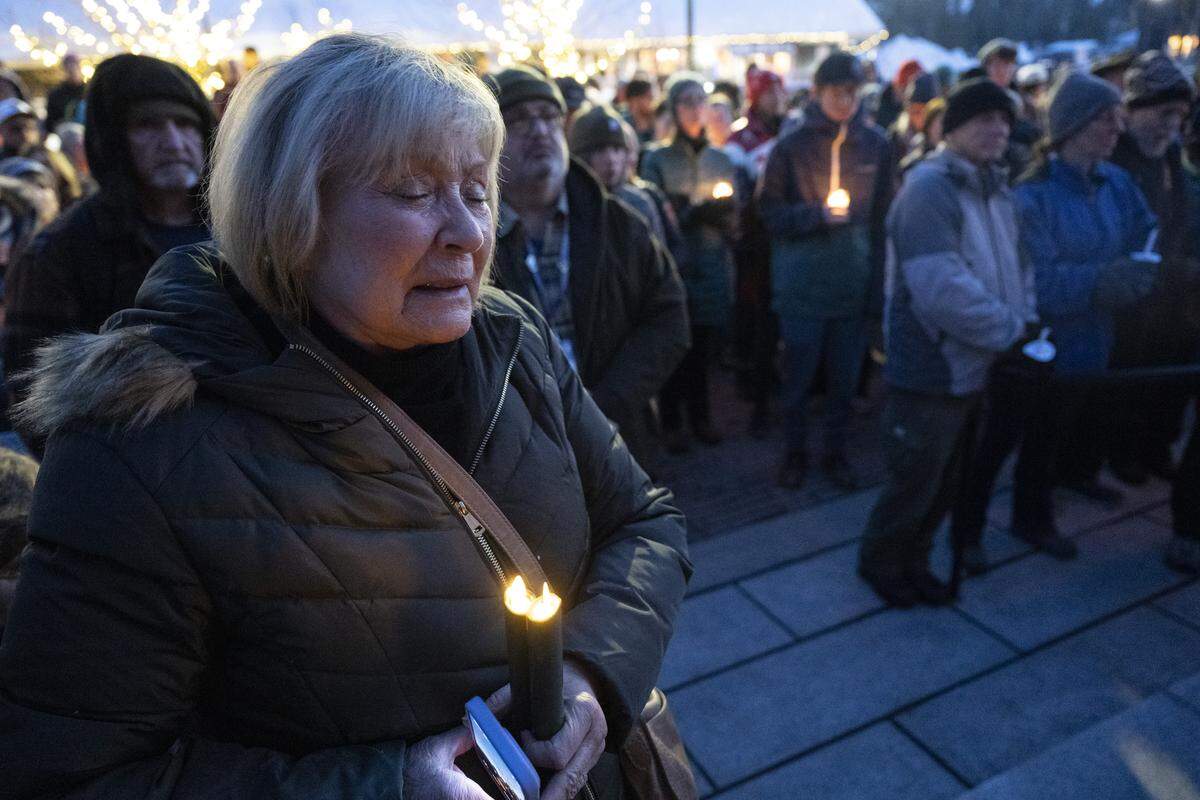 Cathy Simi, of Reno, cries during a vigil in downtown Truckee on Sunday in honor of the victims of a deadly avalanche that struck the Lake Tahoe area the previous week. Simi was friends with one of the victims, Carrie Atkin, and Atkin’s family.