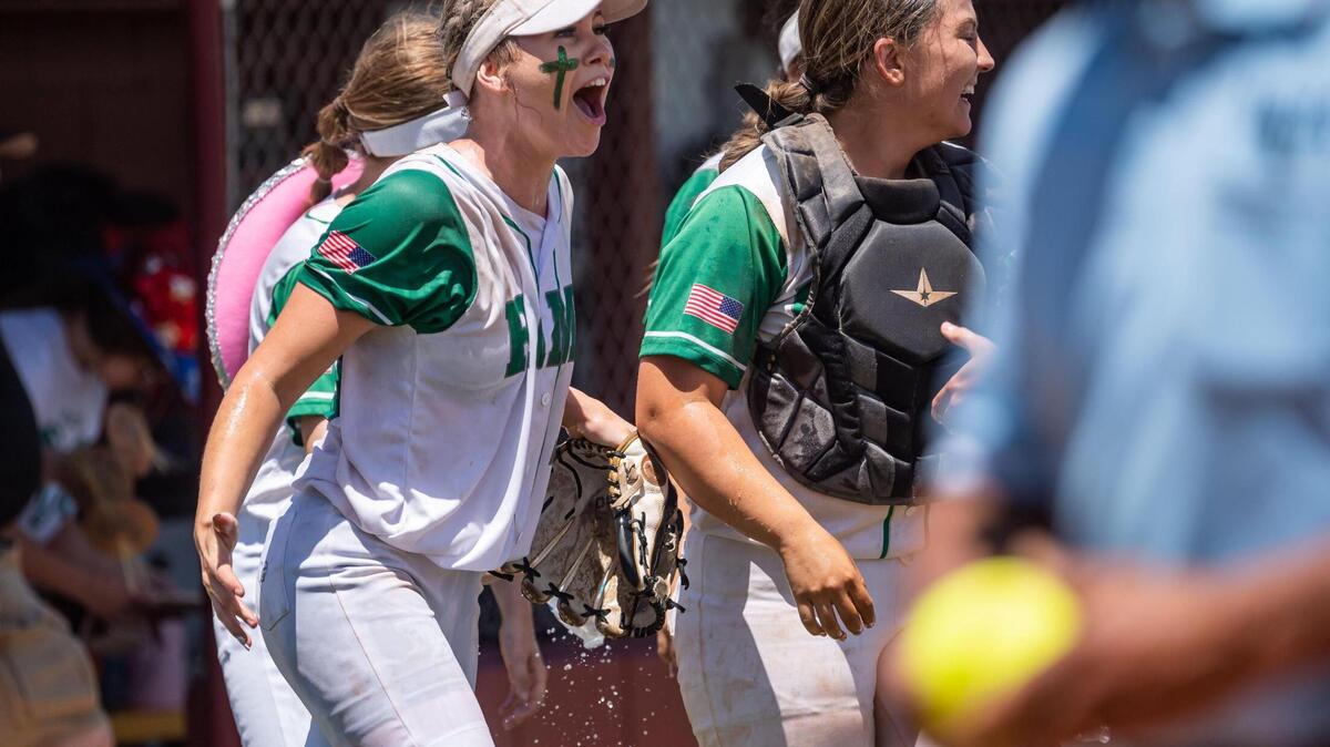 Dixon pitcher Lexi Coyle, left, celebrates with catcher Madi West after the last Marysville out to secure their 10-8 win at the Sac-Joaquin Section Division IV title softball game Saturday at Sacramento City College.