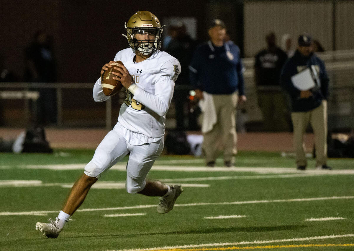 Elk Grove Thundering Herd quarterback David Hale (10) rolls out to pass in the fourth quarter against the Pleasant Grove Eagles on Friday.