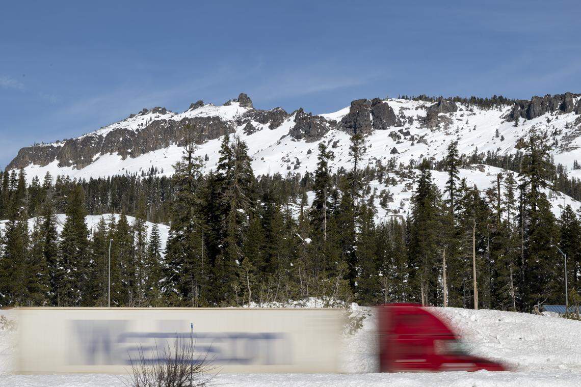 A semi-truck drives past Castle Peak on Interstate 80 near Truckee on Monday, Feb. 23, 2026.