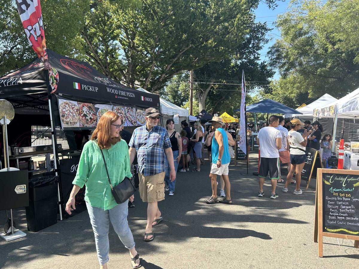 The Midtown Farmers Market bustled with vendors and shoppers on Saturday morning, despite the excessive heat warning issued by the National Weather Service.