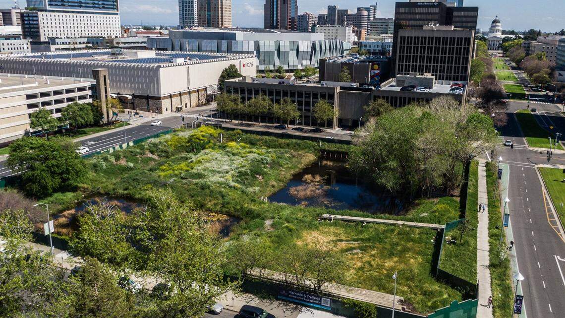 Water pools on Wednesday, April 3, 2024, in the long vacant block at 301 Capitol Mall in downtown Sacramento. State worker pension fund CalPERS sold the property, located at a key entry to the city near the Capitol and Golden 1 Center, to the Shingle Springs Band of Miwok Indians for $17 million.