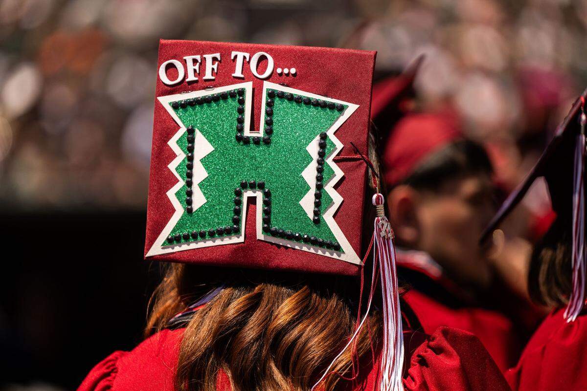 A graduating C.K. McClatchy student wears a University of Hawaii logo on their mortarboard during the commencement ceremony on Tuesday at Sutter Health Park in West Sacramento.