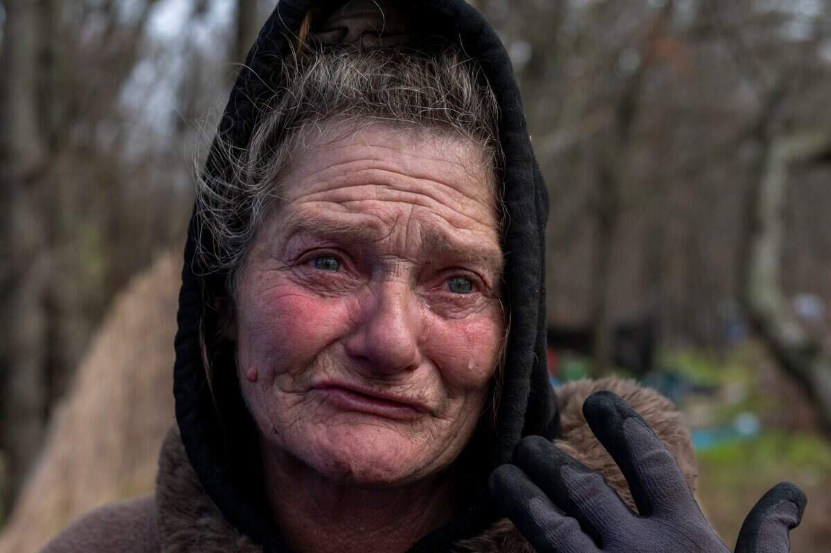 Tears stream down the face of Catherine Roberts, 63, on Feb. 23, while she makes her way to the Bannon Island homeless encampment where she lives. “I’m tired, I can’t afford $1,050,” she said. “I can’t afford the kind of rent they are asking.”