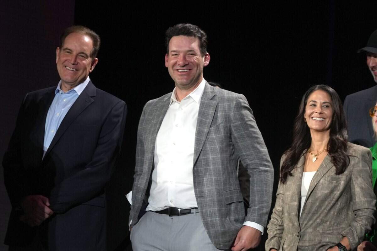 CBS Sports play-by-play announcer Jim Nantz (left), analyst Tony Romo (center) and sideline reporter Tracy Wolfson appear at a press conference at the Super Bowl 58 Media Center at the Mandalay Bay Resort and Casino.