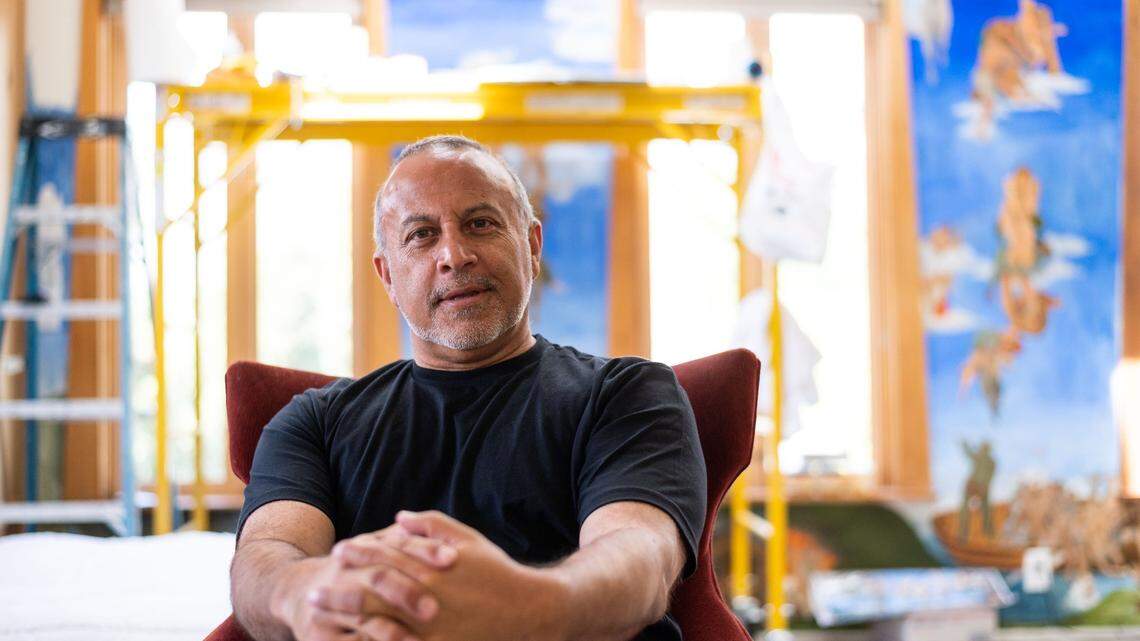 Veteran Republican political consultant Mike Madrid sits in his midtown Sacramento home Friday, April 23, 2021, in front of a mural he’s been painting based on the Sistine Chapel. Madrid is the author of “The Latino Century: How America’s Largest Minority is Transforming Democracy.” It is published by Simon & Schuster