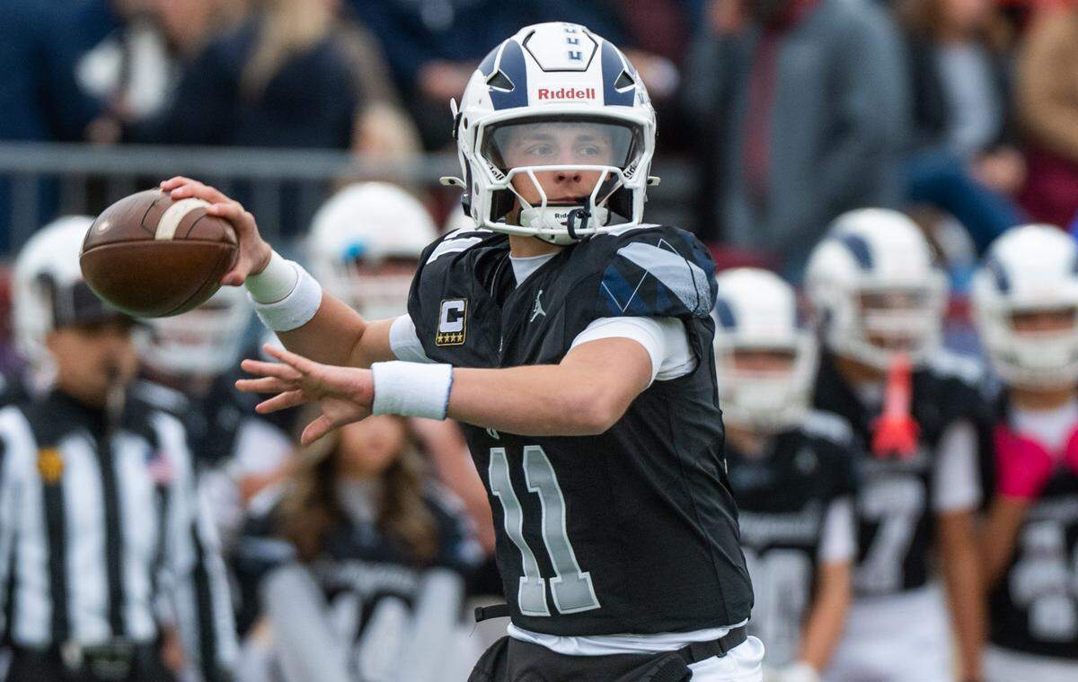 Casa Roble Rams quarterback Aidan Lopez (11) looks downfield against the Sutter Huskies in the CIF Sac-Joaquin Section Division V championship in November. Lopez is The Bee’s Offensive Player of the Year.