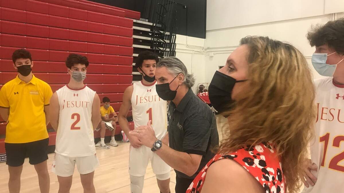 Jesuit volleyball is a family affair for head coach Sara Marks, husband Steve and sons Taylor (No. 1) and Colin (No. 2).