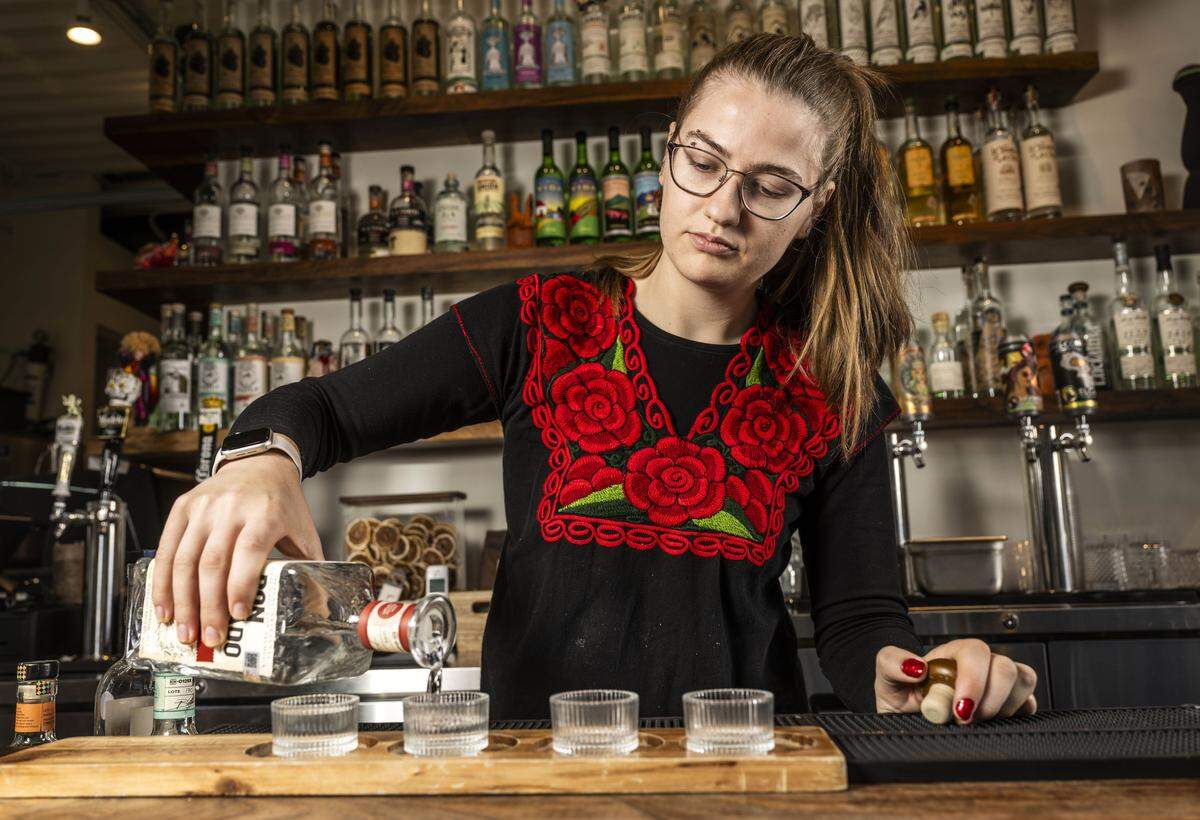 Grace Rovere serves a flight of mezcal at Oaxaca Coctelería and Mezcalería on Tuesday.