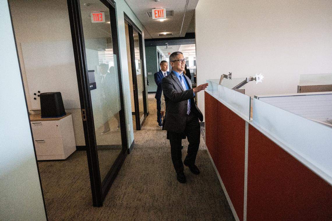 Chris Lee, of the California Department of Tax and Fee Administration tours his office area at the May S. Lee State Office Complex on April 24, 2024.