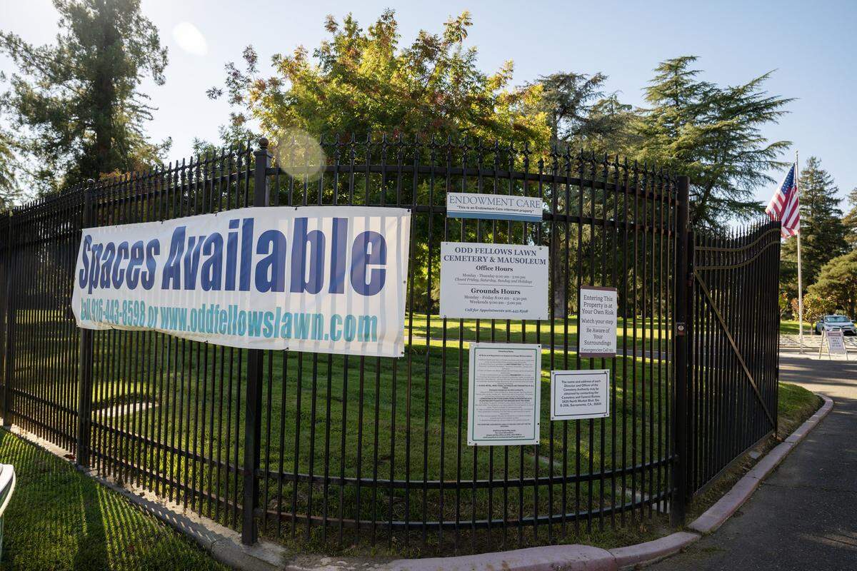 A sign advertises spaces available at Odd Fellows Cemetery on Tuesday in Sacramento.