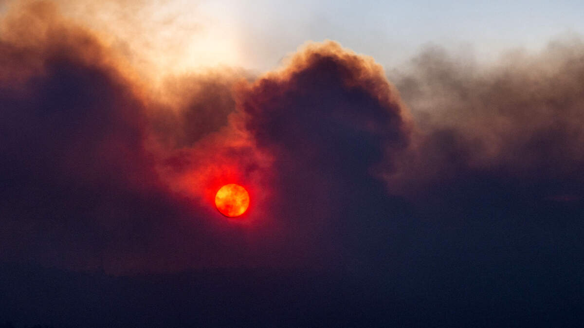 The sun rises as seen through smoke from the Park Fire as seen from Cohasset Road east of Chico on Thursday, July 25, 2024.