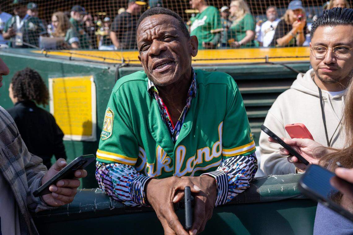 Legendary Oakland A’s player Rick Henderson talks with reporters before the final game at Oakland-Alameda County Coliseum on Thursday.