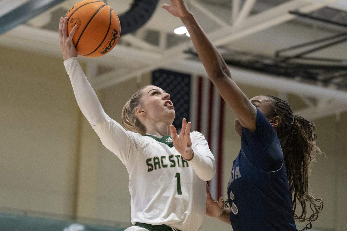 Sacramento State guard Benthe Versteeg (1) goes to shoot against Nevada guard Ahrray Young (1) during a game against Nevada at Hornet Pavilion in Sacramento on Thursday, Nov. 6.