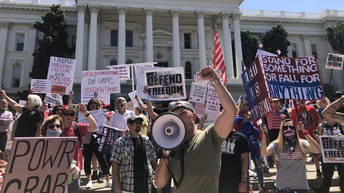 Cordie Williams chants “open up” at a protest against Gov. Gavin Newsom’s stay-at-home order at the California Capitol on Friday, May 1, 2020, in Sacramento.