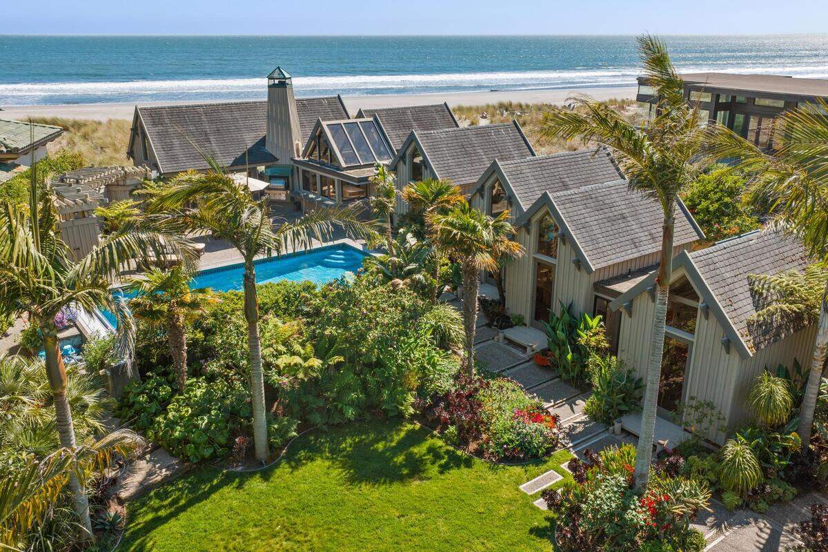 The five-bedroom property at 172 Seadrift Road is being pitched as a private tropical retreat — one that blends Tahitian and Balinese design with a front-row ocean setting on one of California’s most storied stretches of sand.