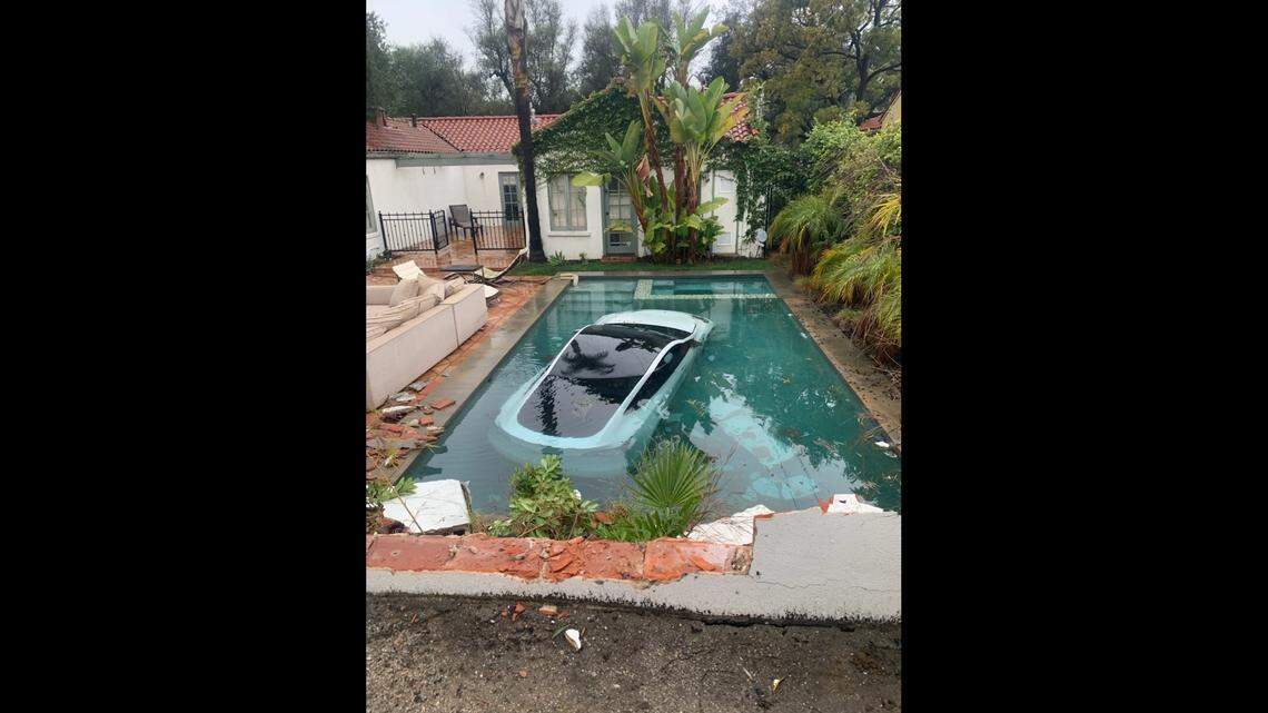 A Tesla driver crashed into a pool on Jan. 10, 2023, in Pasadena, California, officials said. A 4-year-old boy, his mother and grandmother were inside the vehicle.