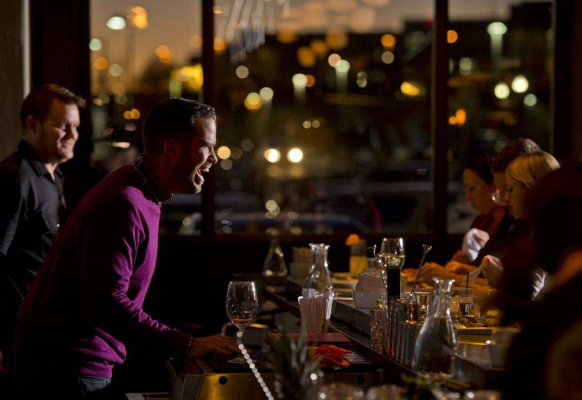 Nick Dedier, co-owner of Aji Japanese Bistro in El Dorado Hills mingles with customers on Tuesday night, January 21, 2014. Dedier returned to the region following management jobs with Thomas Keller and other world class restaurant groups.