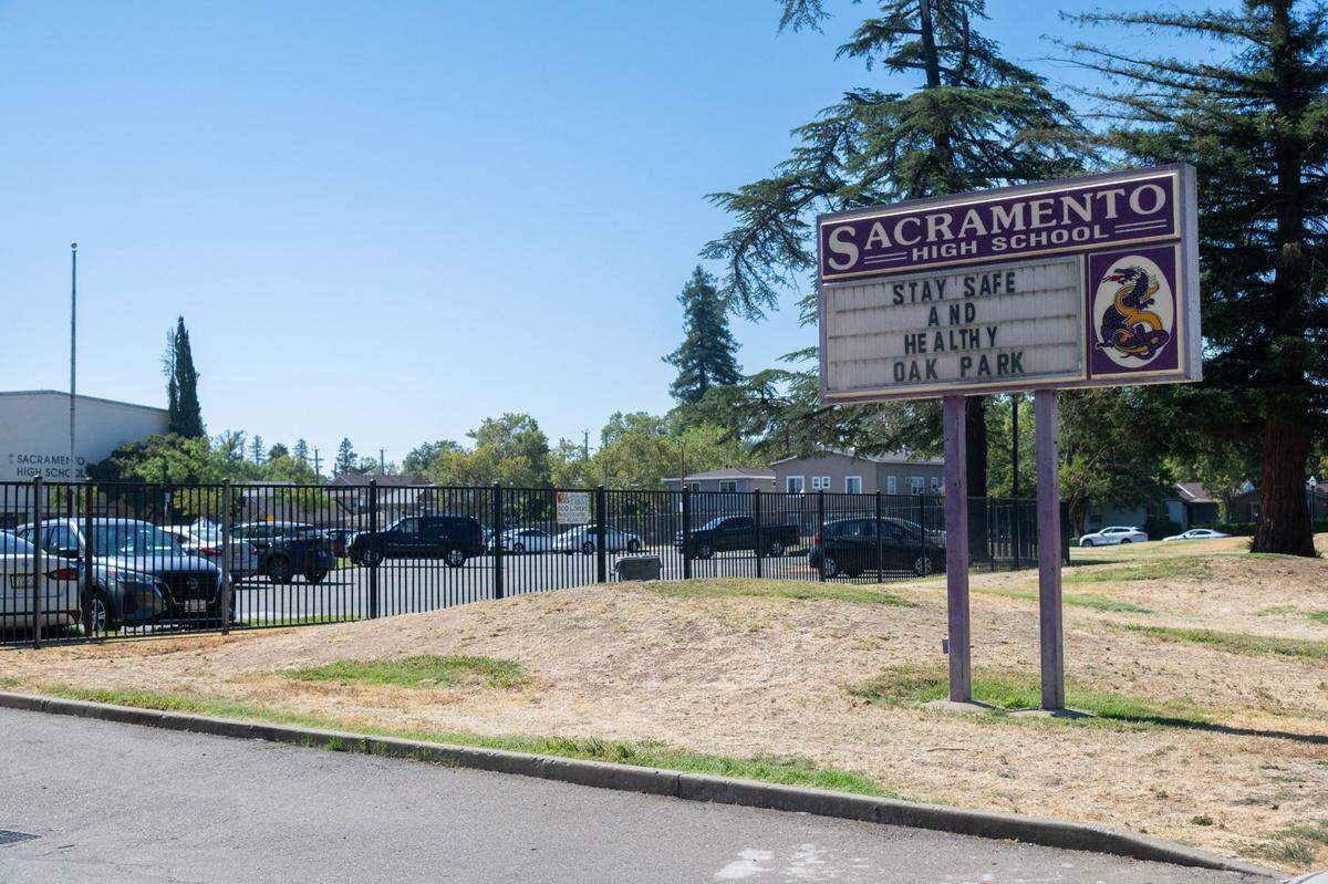 Sacramento High School stands on 34th Street on Tuesday, Aug. 6, 2024. The sign in front of the school reads “Stay safe and healthy Oak Park.”
