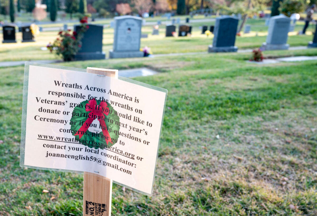 A sign is posted by Wreaths Across America at the Newcastle Cemetery on Wednesday lets people know how to donate for the wreath laying of 1,252 veterans’ graves at the Newcastle, Rocklin, Gold Hill and Ophir cemeteries in Placer County.
