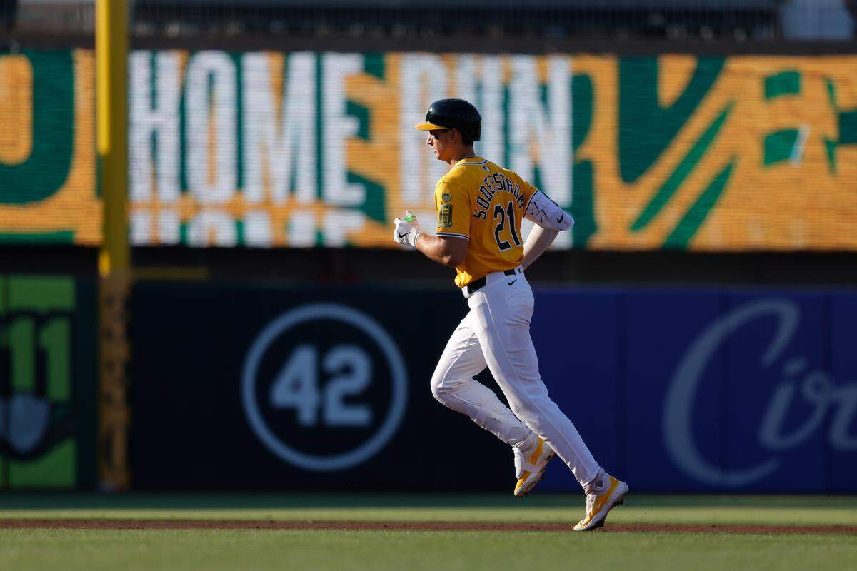 Jul 10, 2025; West Sacramento, California, USA; Athletics left fielder Tyler Soderstrom (21) rounds the bases after hitting a three run home run during the first inning against the Atlanta Braves at Sutter Health Park. Mandatory Credit: Sergio Estrada-Imagn Images