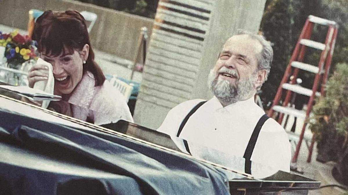 Bob Ringwald plays the piano and cracks a joke with family including daughter Molly, left, in an undated photo. Bob Ringwald, a well-known musician in the Sacramento jazz scene, died Tuesday, Aug. 3, 2021. He was 80.
