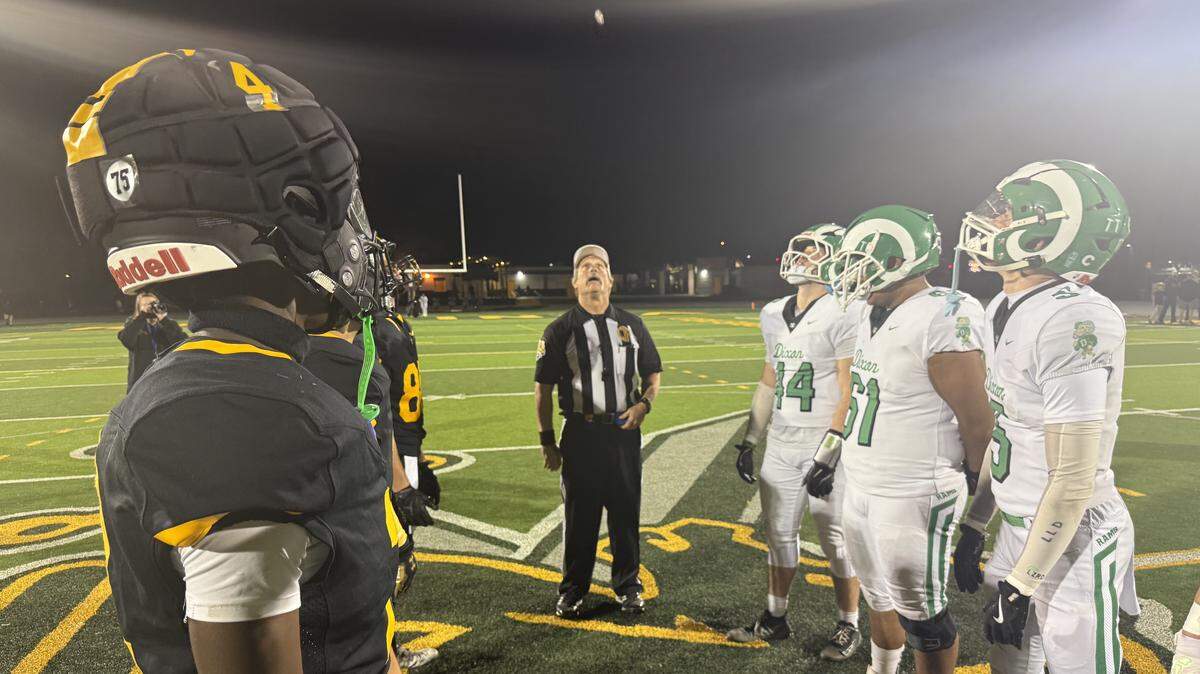 Players watch the coin flip before Rio Linda Golden Knights faced the Dixon Rams on Friday at Rio Linda High School.