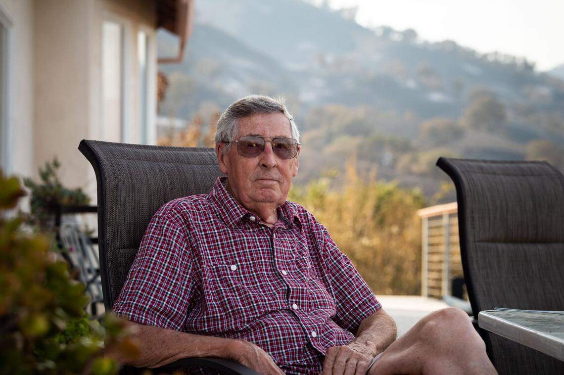 Longtime teacher and retired principal for Paradise High School, Jerry Balasek sits on a deck in Vacaville on Saturday, Aug. 22, 2020, at the home where he lives with his son and daughter-in-law. In 2018, he narrowly escaped the Camp Fire and said that fleeing their Solano County home last week from the LNU Lightning Complex fire was even more harrowing. Their home was spared but much of the property was burned.