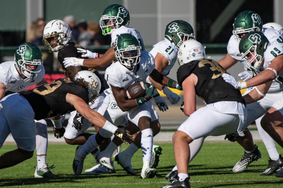 Cal Poly Mustangs wide receiver Kahliq Paulette (1) runs the ball to the 20-yard line on the kick return before being tackled by Sacramento State Hornets linebacker Derek Houston (39) in the first half of the NCAA football game at Hornet Stadium on Saturday, Nov. 11, 2023.