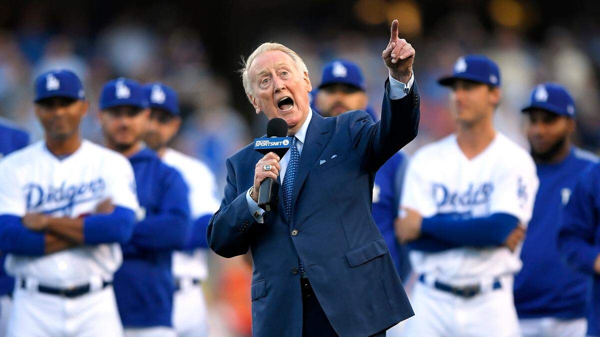 Los Angeles Dodgers broadcaster Vin Scully speaks during his induction into the team’s Ring of Honor prior to a baseball game between the Dodgers and the San Francisco Giants in Los Angeles on May 3, 2017, in Los Angeles. Scully, whose dulcet tones provided the soundtrack of summer while entertaining and informing Dodgers fans in Brooklyn and Los Angeles for 67 years, died Aug. 2, 2022.