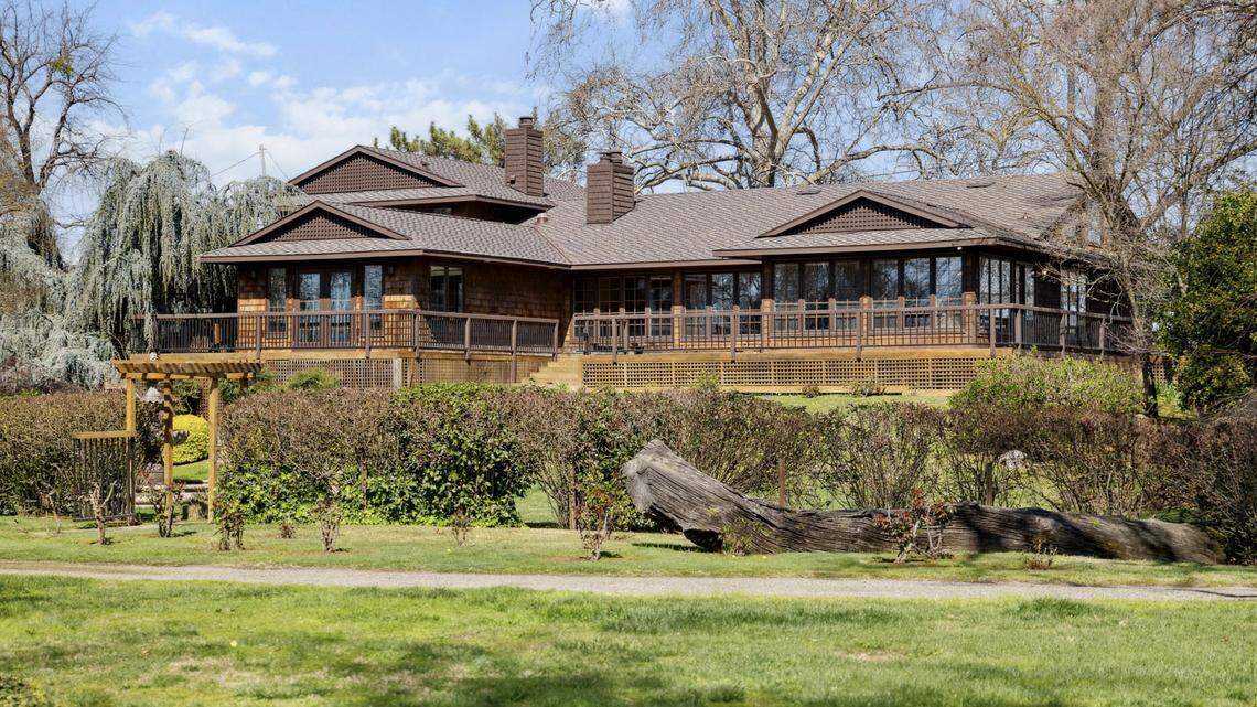 The elegant Craftsman-style home at 4201 Garden Highway on the Sacramento River, thoughtfully renovated by Ray Takata, blends timeless architecture with serene Japanese influences.