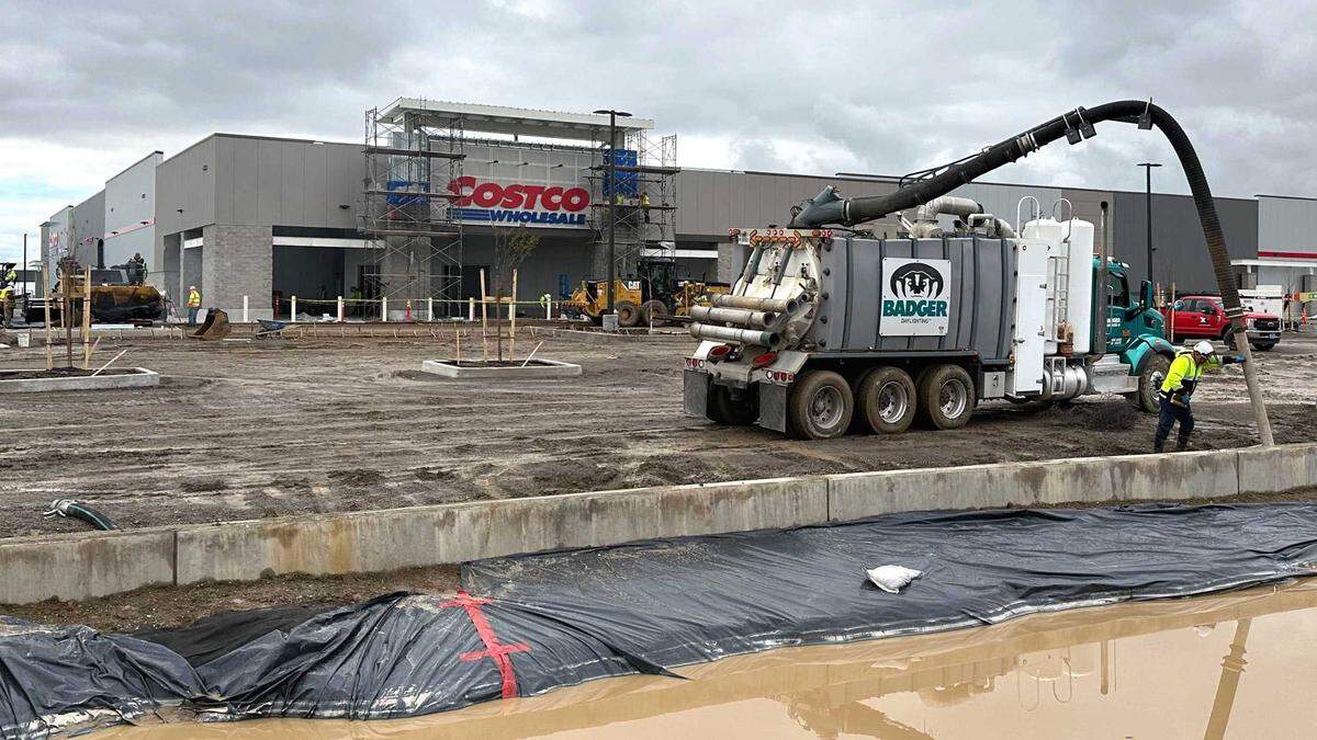 A construction worker pours concrete for the parking lot of the soon-to-open Costco location near Arena Boulevard in the Natomas Crossing section of Sacramento on Thursday, Feb. 8, 2024. A city councilwoman said the big-box membership retailer’s newest capital region location will open March 14.