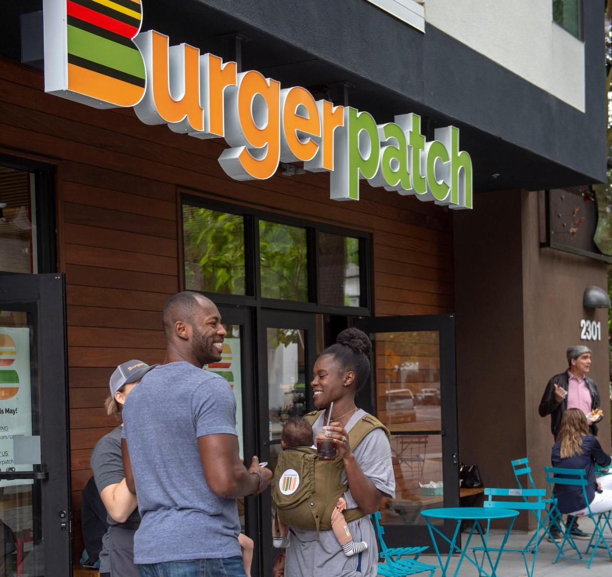 Customers stand outside vegan fast food restaurant Burger Patch in midtown Sacramento in 2019. The midtown restaurant shut down in early September 2025.