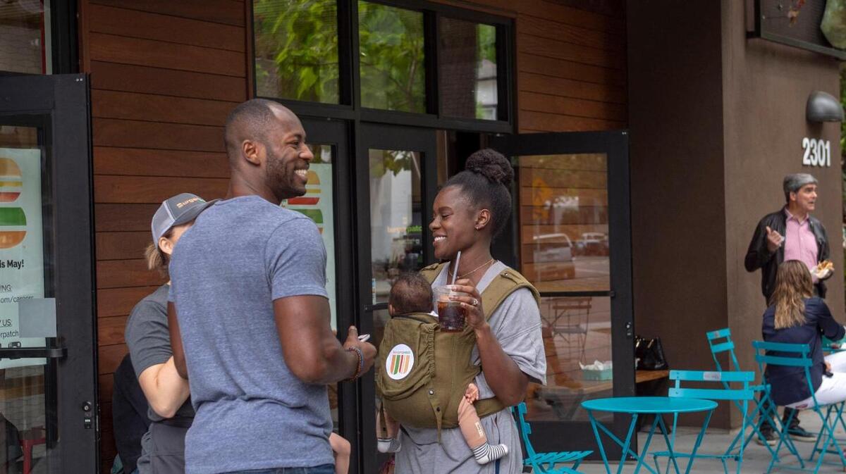 Customers stand outside vegan fast food restaurant Burger Patch in midtown Sacramento in 2019.