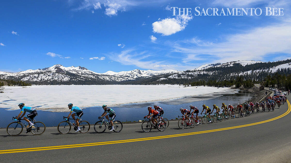 The peloton rides past Caples Lakes during Stage 2 of the Amgen Tour of California on May 13, 2019.
