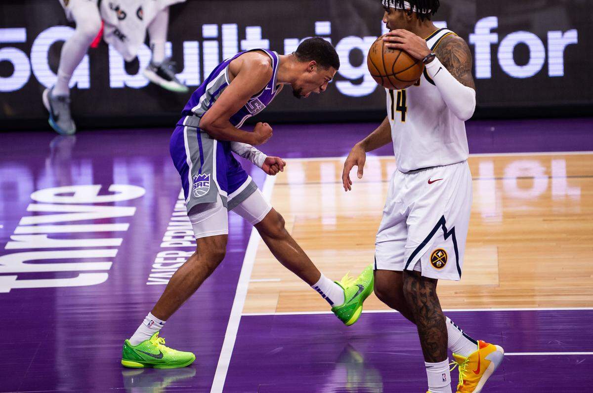 Sacramento Kings guard Tyrese Haliburton (0) celebrates scoring on a fast break past Denver Nuggets guard Gary Harris (14) after a turnover by Sacramento Kings forward Harrison Barnes (40) during a rally in the fourth period of the NBA game Tuesday, Dec. 29, 2020, at Golden 1 Center in Sacramento. The Kings beat the Nuggets 125-115.